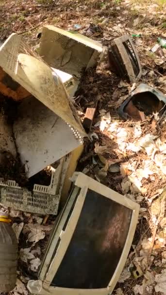 Vertical video of the computer in a junkyard in the forest, slow motion — Stock Video