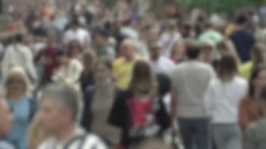 Megapolis: silhouettes of people walking in a crowd