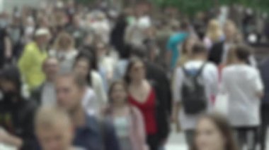 Megapolis: silhouettes of people walking in a crowd