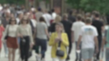 Megapolis: silhouettes of people walking in a crowd