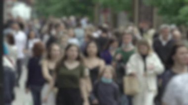 Megapolis: silhouettes of people walking in a crowd
