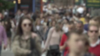 Megapolis: silhouettes of people walking in a crowd