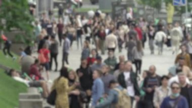 Megapolis: silhouettes of people walking in a crowd