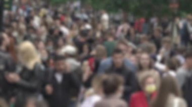 Megapolis: silhouettes of people walking in a crowd