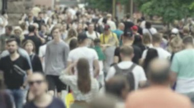 Silhouettes of many people in a big city