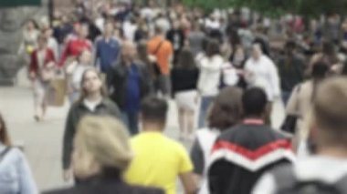 Silhouettes of many people in a big city