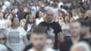 Silhouettes of many people in a big city