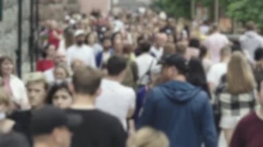 Silhouettes of many people in a big city
