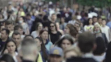 Silhouettes of many people in a big city