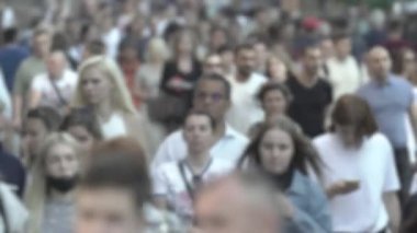 Silhouettes of many people in a big city