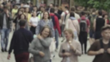 Silhouette of a crowd in a metropolis during the day