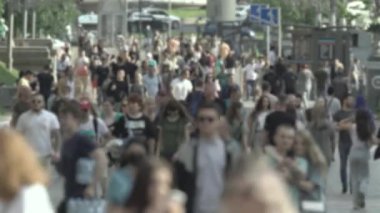 Silhouette of a crowd in a metropolis during the day