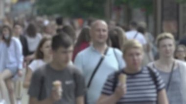 Silhouette of a crowd in a metropolis during the day