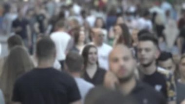 Silhouette of a crowd in a metropolis during the day