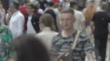 Silhouette of a crowd in a metropolis during the day