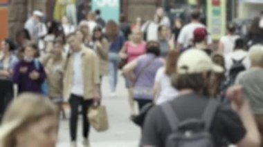 Silhouette of a crowd in a metropolis during the day