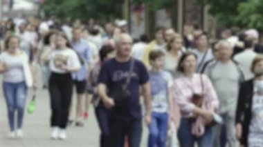 Silhouette of a crowd in a metropolis during the day