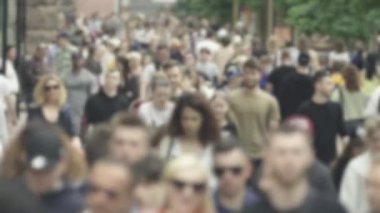 Silhouette of a crowd in a metropolis during the day