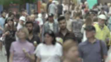 Silhouette of a crowd in a metropolis during the day
