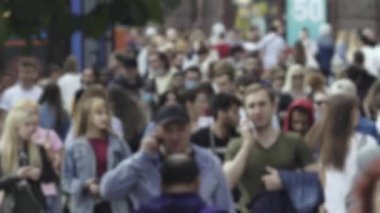 Silhouette of a crowd in a metropolis during the day