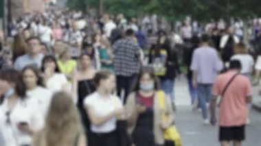 Silhouette of a crowd in a metropolis during the day