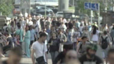 Silhouette of a crowd in a metropolis during the day