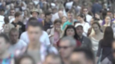 Silhouette of a crowd in a metropolis during the day