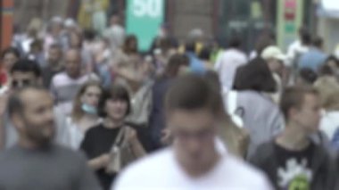 Silhouette of a crowd in a metropolis during the day