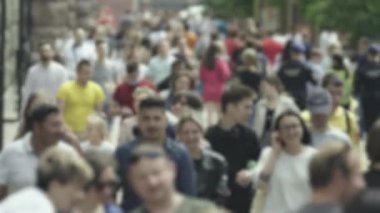 Silhouette of a crowd in a metropolis during the day