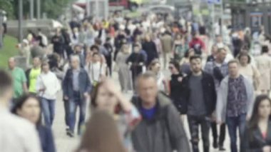 Silhouette of a crowd in a metropolis during the day
