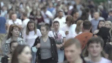 Silhouette of a crowd in a metropolis during the day