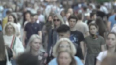 Silhouette of a crowd in a metropolis during the day