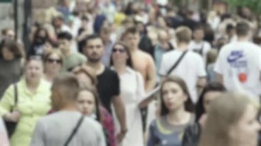 Silhouette of a crowd in a metropolis during the day