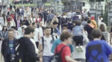 Silhouette of a crowd in a metropolis during the day