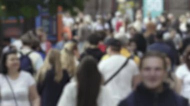 Silhouette of a crowd in a metropolis during the day