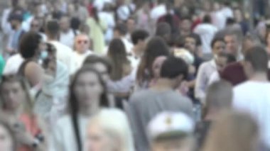 Silhouette of a crowd in a metropolis during the day