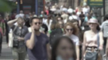 Silhouette of a crowd in a metropolis during the day