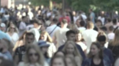 Silhouette of a crowd in a metropolis during the day