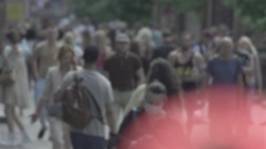 Silhouette of a crowd in a metropolis during the day