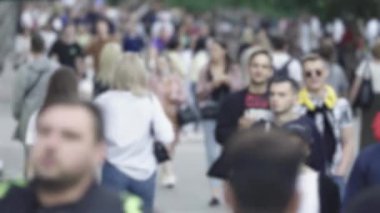 Silhouette of a crowd in a metropolis during the day