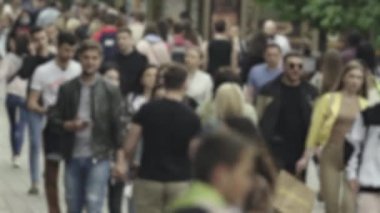 Silhouette of a crowd in a metropolis during the day