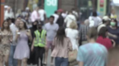Silhouette of a crowd in a metropolis during the day