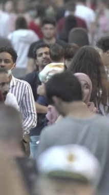 Vertical video of a crowd of people