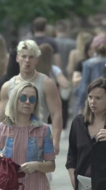 Vertical video of a crowd of people