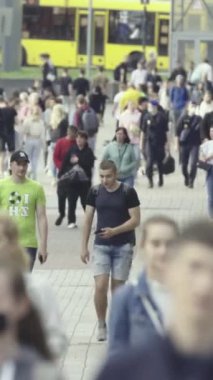 Vertical video of a crowd of people in the city