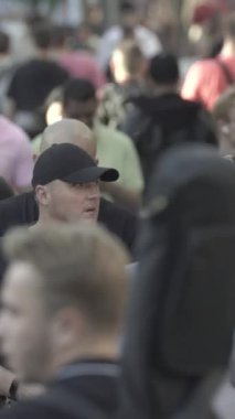 Vertical video of a crowd of people in the city