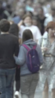Vertical video of a crowd of people in the city