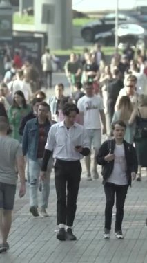 Vertical video of a crowd of people in the city
