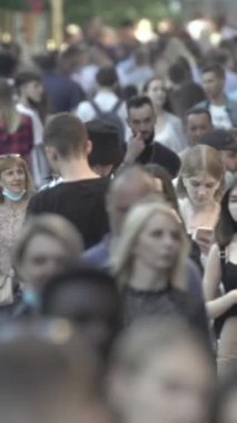 Vertical video of a crowd of people in the city
