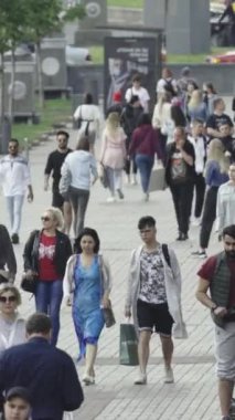Vertical video of a crowd of people in the city